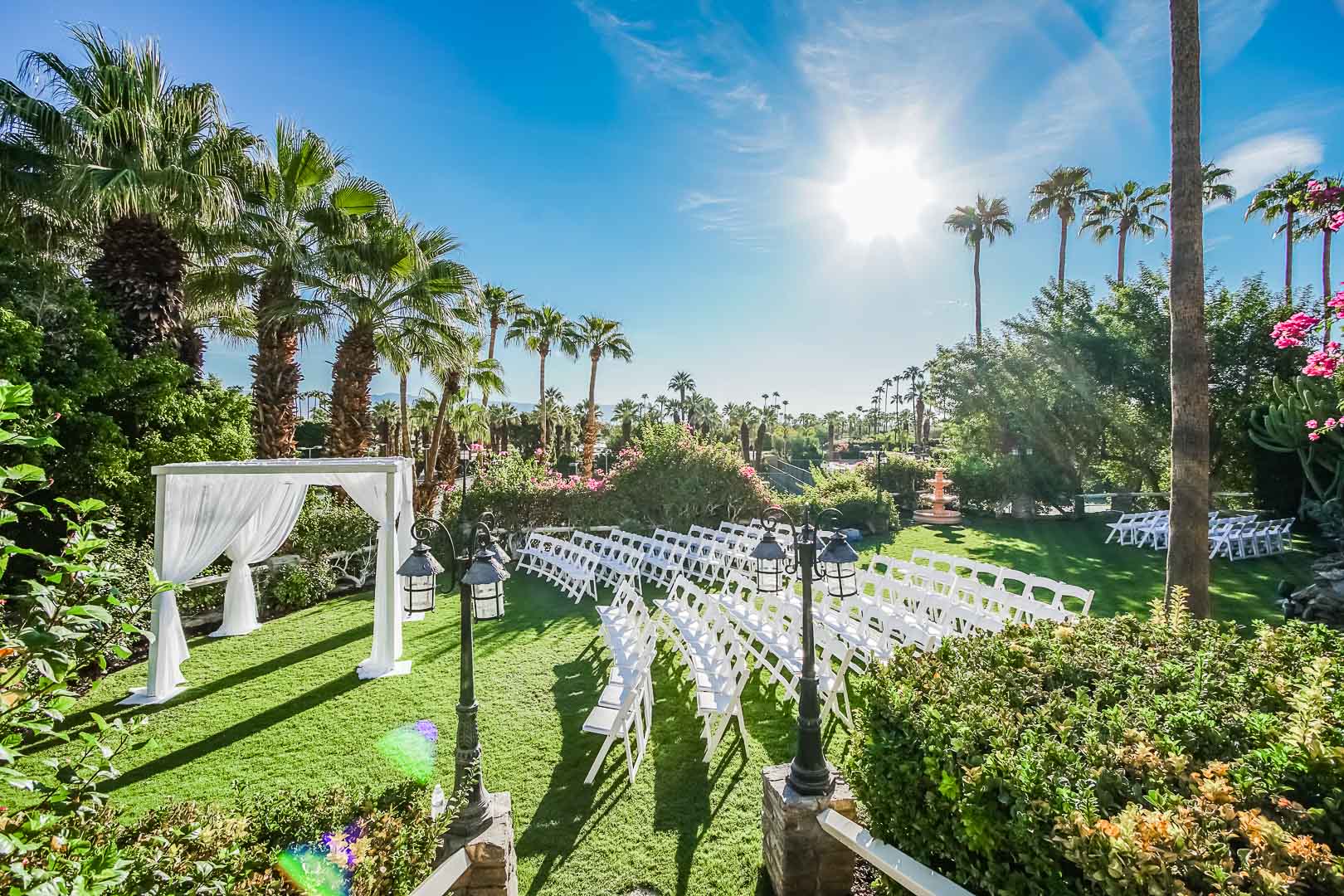 A breathtaking view of an outdoor wedding ceremony at VRI's Palm Springs Tennis Club in California.